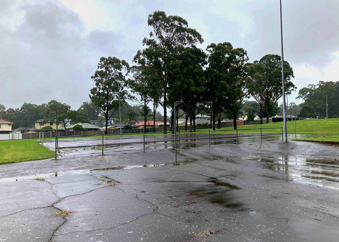 Run down netball courts on a rainy day