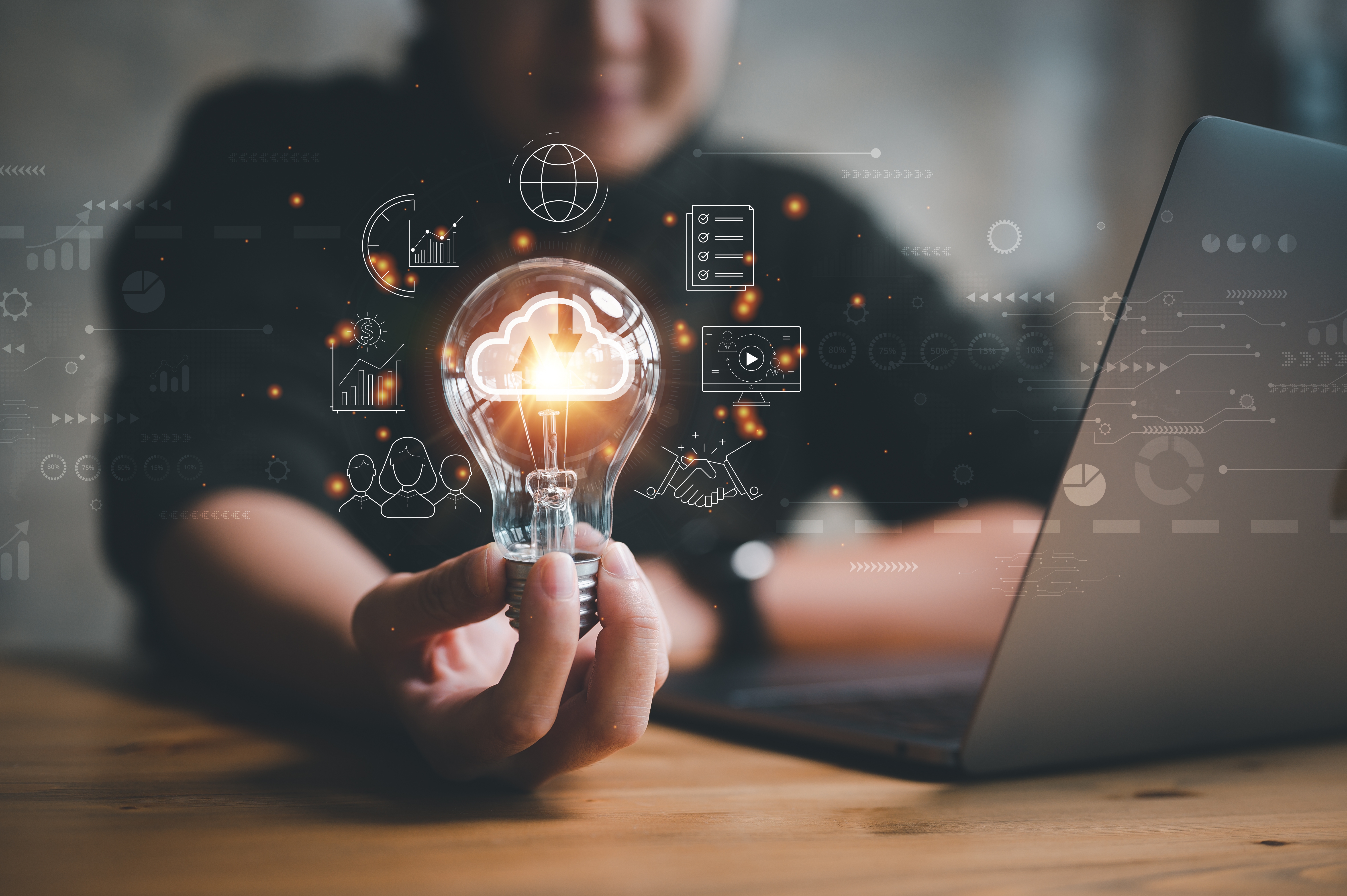 Person holding a lightbulb showcasing smart technology